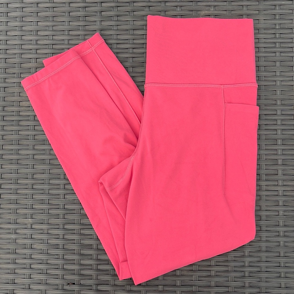 Athleta Salutation stash pocket II 7/8 tight Size medium